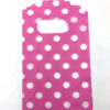 Sieradenzakje roze met witte stippen